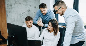 Boopro Tech team collaborating at a workstation